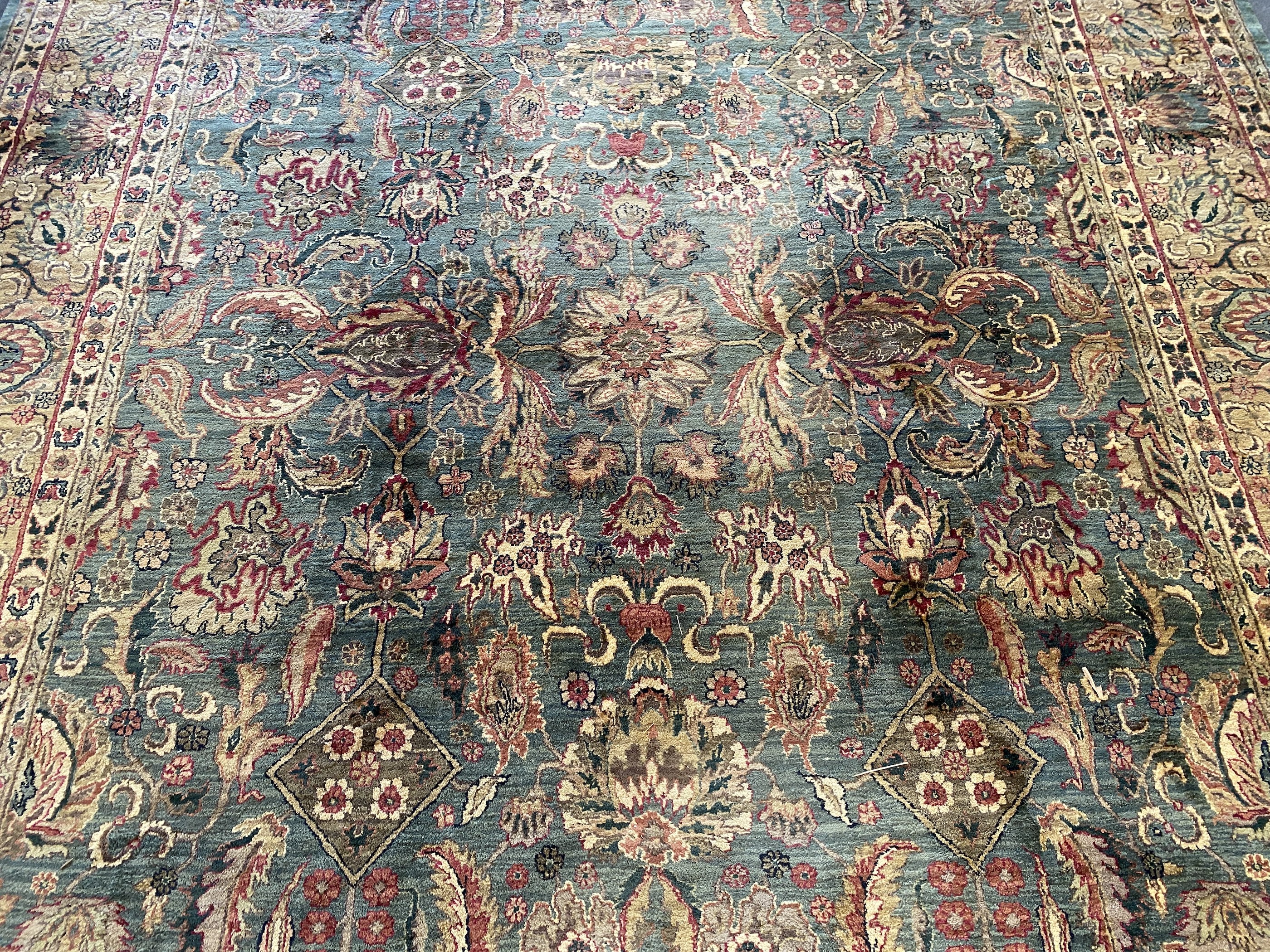 An Indian Persian style sage green ground carpet, 465 x 363cm